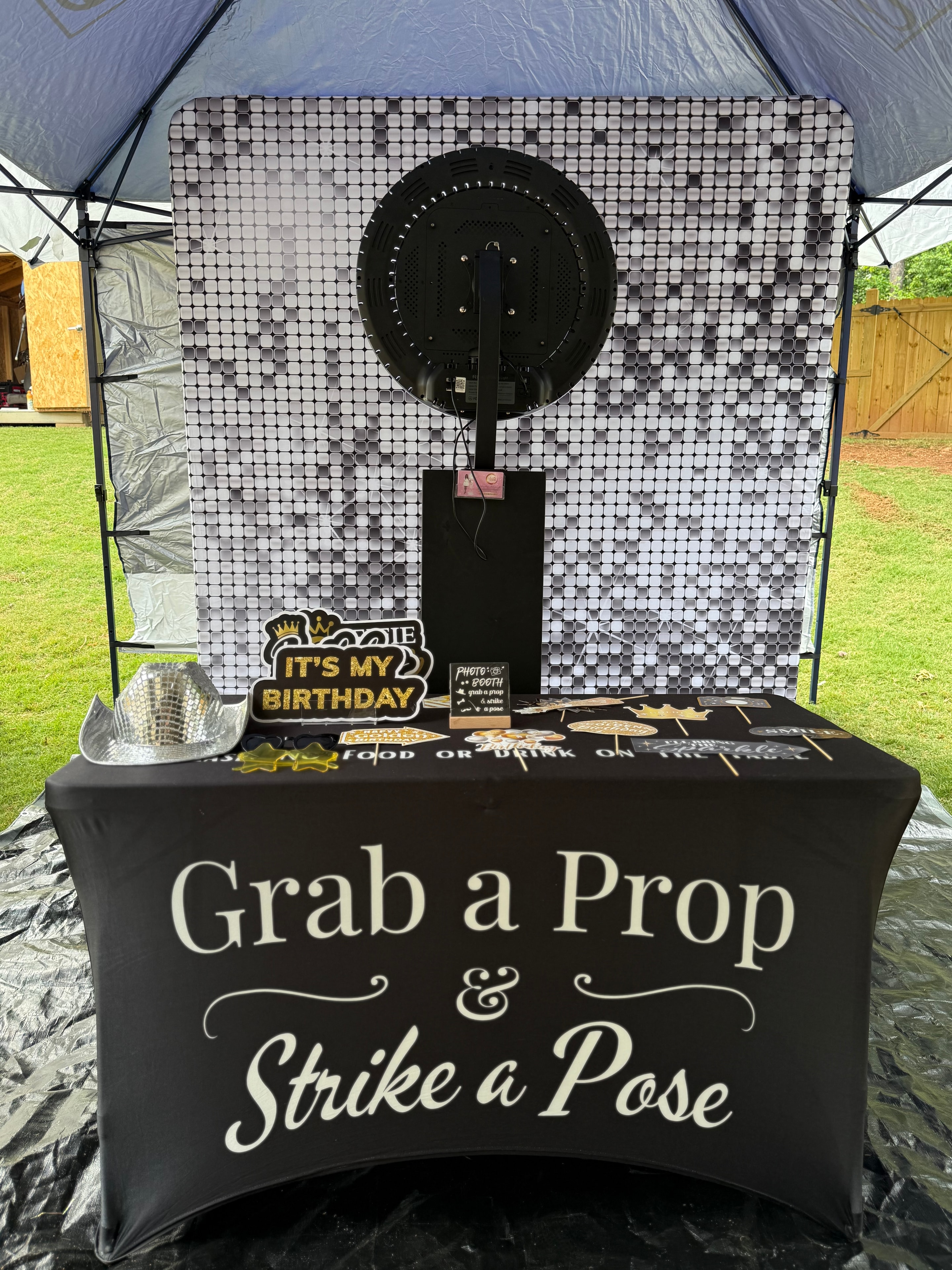 Birthday photo booth prop table with sequin backdrop