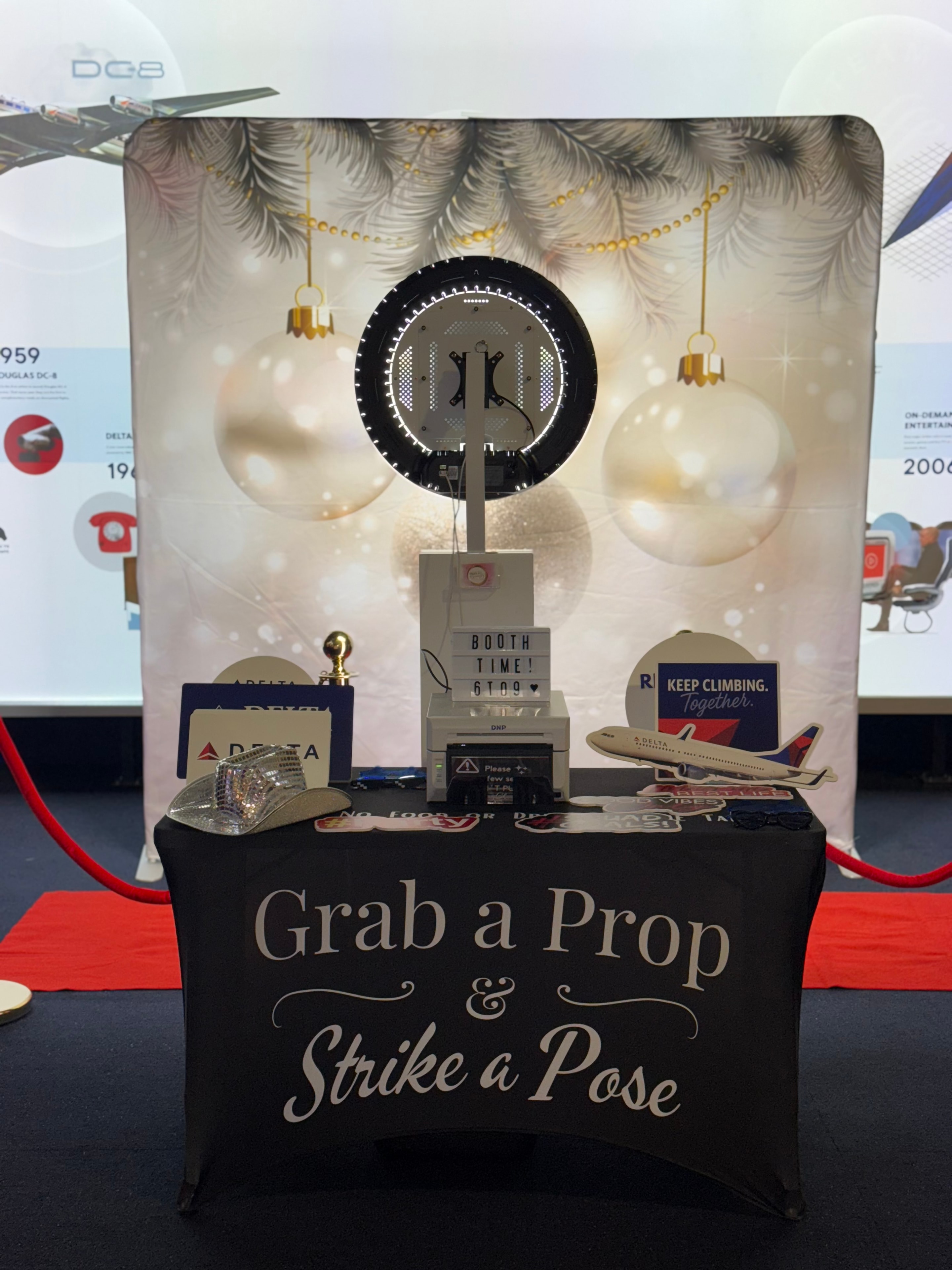 Delta Airlines holiday party photo booth setup with branded props