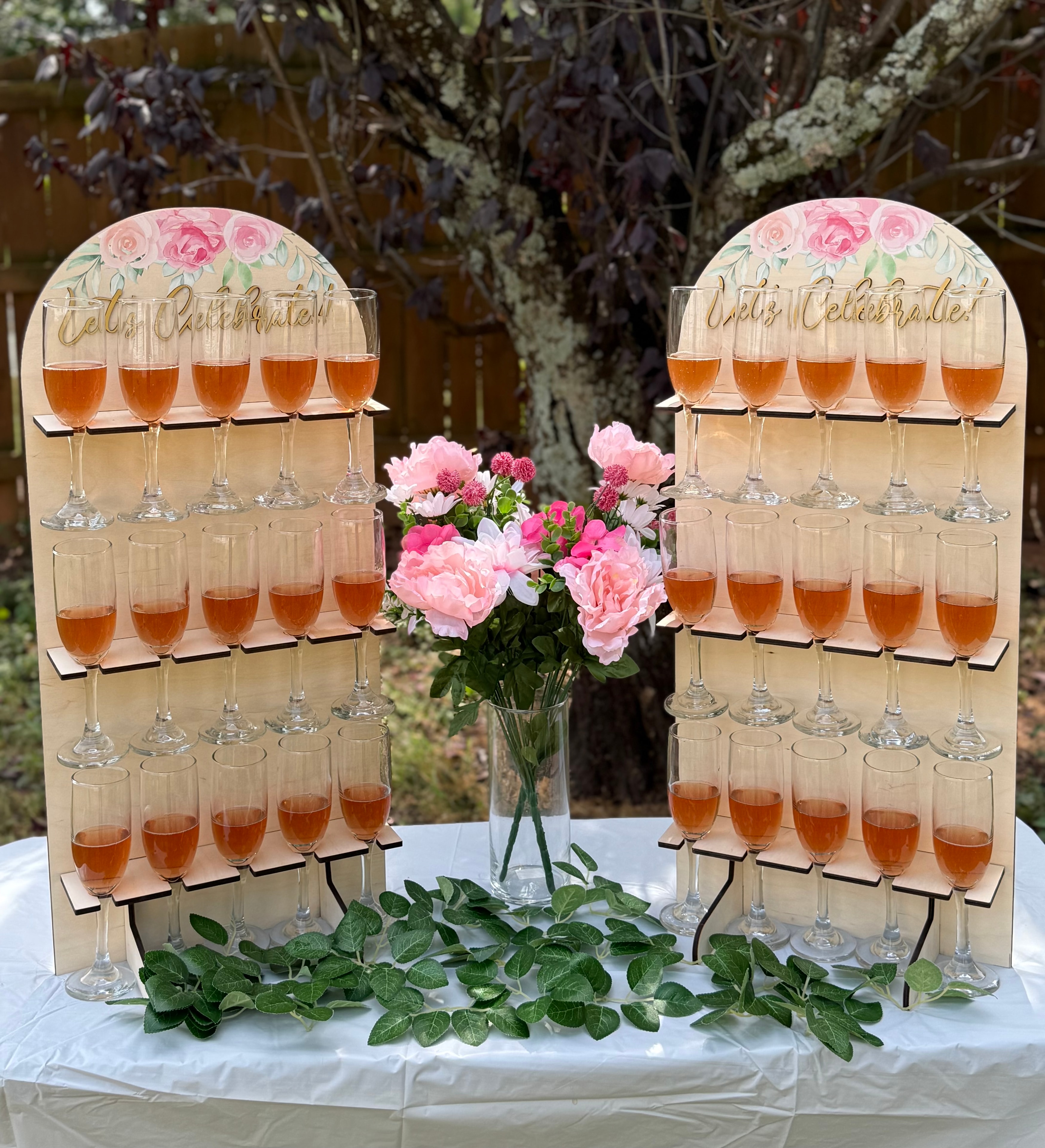 Arched champagne wall with floral accents for Atlanta celebrations